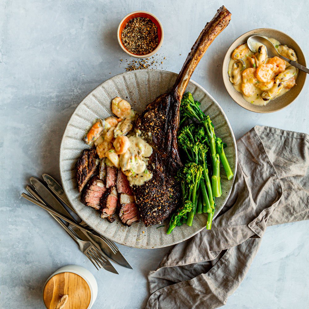Triple pepper tomahawk steak with creamy prawnmussel sauce recipe