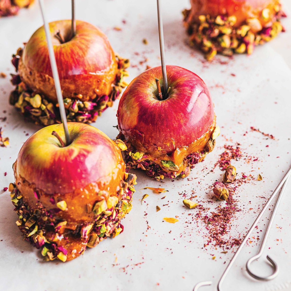 Saffron, rose water and pistachio toffee apples recipe