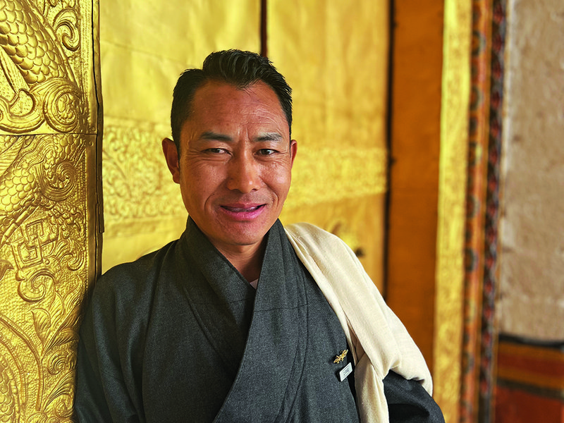 Tiger’s Nest clings precariously to the side of a steep cliff | Prayer flags are a common sight throughout the country | One of COMO Hotel’s most experienced guides, Tshering | 300-year-old Punakha Dzong fortress