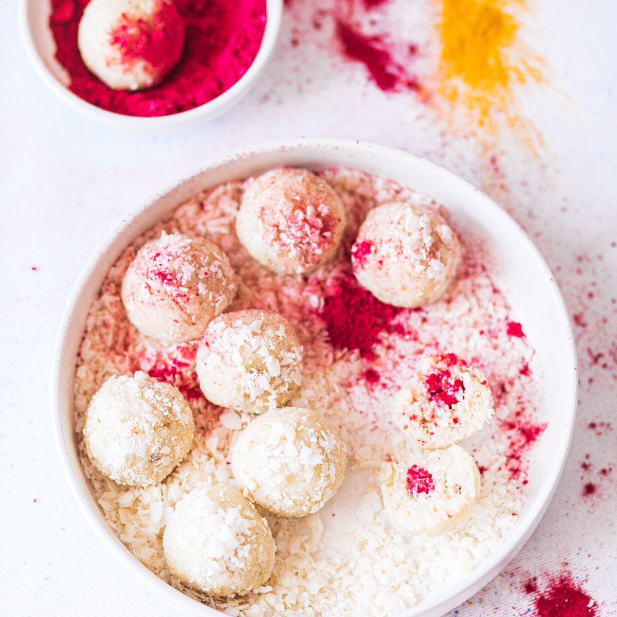 Coconut and rose ladoos with raspberry centres