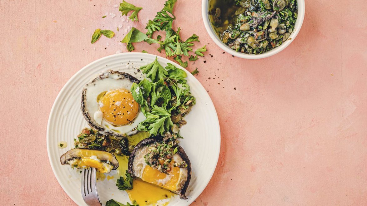 Egg-stuffed portobello mushrooms with sultana pesto