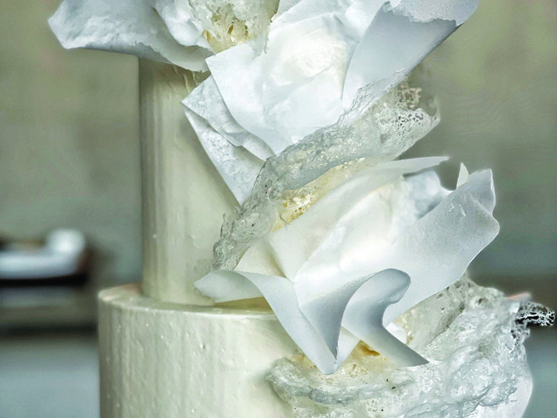 Nadia’s watermelon cake designed to raise money for charity in Gaza │ Quality control is important to the Dubai-based baker │ Nadia works on bespoke cake designs for her customers │ Edible wax paper was used to create the messaging │ Telling stories through cake designs