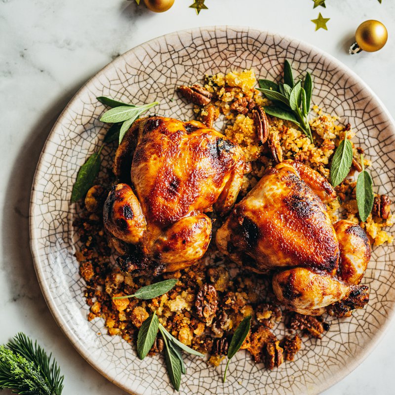 Brown butter, miso and maple roasted Spanish poussins with pecan tray bake stuffing