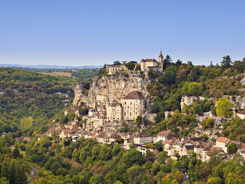 The picturesque village of Rocamadour sits on a cliff | Cyprian Duroux is a fourth-generation cheesemaker | Laguiole is a pressed, uncooked cheese that has been made since the 12th century | Alpine goats at La Borie d’Imbert, a farm renowed for making Rocamadour | Alain Guittard handcrafts Saint-Nectaire cheese | Rinds are washed by hand at Mons Cheese